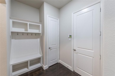 A beautifully designed 3-bedroom, 2-bathroom home by Meritage on The Tribute At the Colony in Texas - for sale on GolfHomes.com, golf home, golf lot