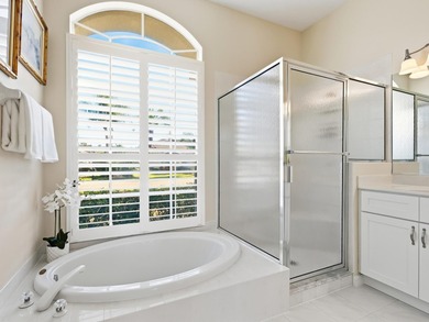 Enjoy tranquil lake views from this beautifully updated on Pelican Pointe Golf and Country Club in Florida - for sale on GolfHomes.com, golf home, golf lot