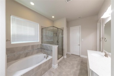 A beautifully designed 3-bedroom, 2-bathroom home by Meritage on The Tribute At the Colony in Texas - for sale on GolfHomes.com, golf home, golf lot