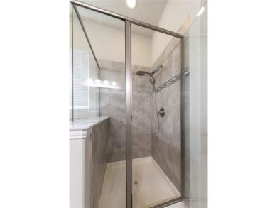 A beautifully designed 3-bedroom, 2-bathroom home by Meritage on The Tribute At the Colony in Texas - for sale on GolfHomes.com, golf home, golf lot