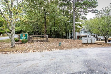 This stunning, updated studio is tucked away among the trees on on Mountain Ranch Golf Club in Arkansas - for sale on GolfHomes.com, golf home, golf lot