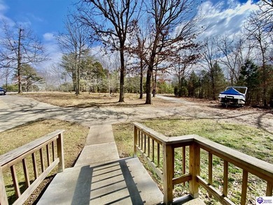 Lakefront Home with 2 Docks on 3 lots totaling 3.43 acres. Docks on Rough River Dam State Resort Park Golf Course in Kentucky - for sale on GolfHomes.com, golf home, golf lot