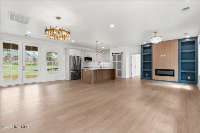 Welcome to 355 S Middleton Dr NW, a stunning new construction on Brunswick Plantation and Golf Resorts in North Carolina - for sale on GolfHomes.com, golf home, golf lot