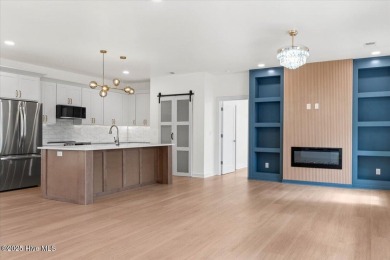 Welcome to 355 S Middleton Dr NW, a stunning new construction on Brunswick Plantation and Golf Resorts in North Carolina - for sale on GolfHomes.com, golf home, golf lot