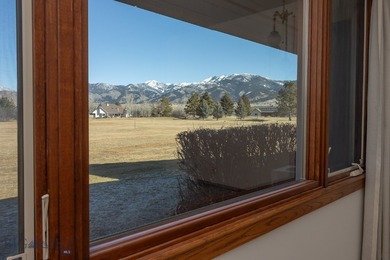 Spectacular views of the Bridger Mountain Range from this home on Riverside Country Club in Montana - for sale on GolfHomes.com, golf home, golf lot