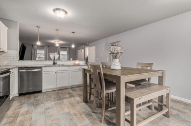 Welcome to this spacious 4-bedroom, 2.5-bath set on nearly half on Lake Doster Golf Club in Michigan - for sale on GolfHomes.com, golf home, golf lot