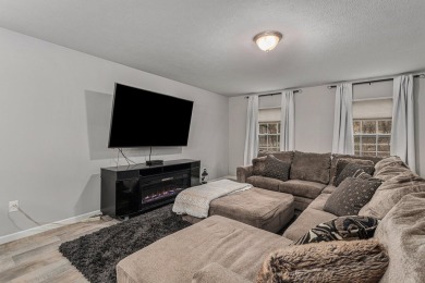 Welcome to this spacious 4-bedroom, 2.5-bath set on nearly half on Lake Doster Golf Club in Michigan - for sale on GolfHomes.com, golf home, golf lot