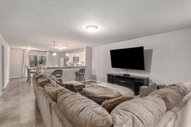 Welcome to this spacious 4-bedroom, 2.5-bath set on nearly half on Lake Doster Golf Club in Michigan - for sale on GolfHomes.com, golf home, golf lot