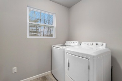 Welcome to this spacious 4-bedroom, 2.5-bath set on nearly half on Lake Doster Golf Club in Michigan - for sale on GolfHomes.com, golf home, golf lot