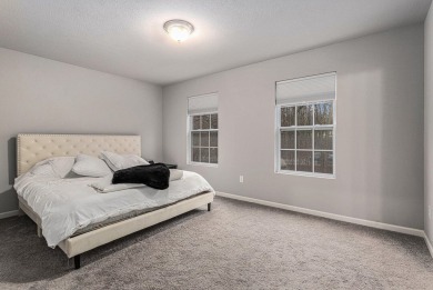 Welcome to this spacious 4-bedroom, 2.5-bath set on nearly half on Lake Doster Golf Club in Michigan - for sale on GolfHomes.com, golf home, golf lot