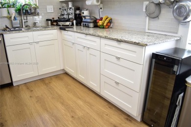 Large 1st Floor corner unit.  Privateplete impact glass on Sunrise Lakes Phase III in Florida - for sale on GolfHomes.com, golf home, golf lot