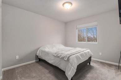 Welcome to this spacious 4-bedroom, 2.5-bath set on nearly half on Lake Doster Golf Club in Michigan - for sale on GolfHomes.com, golf home, golf lot