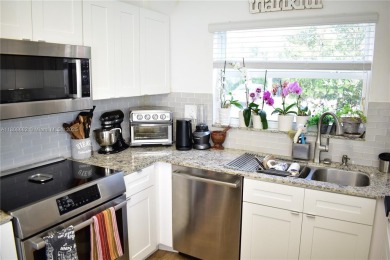 Large 1st Floor corner unit.  Privateplete impact glass on Sunrise Lakes Phase III in Florida - for sale on GolfHomes.com, golf home, golf lot