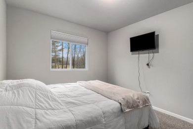 Welcome to this spacious 4-bedroom, 2.5-bath set on nearly half on Lake Doster Golf Club in Michigan - for sale on GolfHomes.com, golf home, golf lot