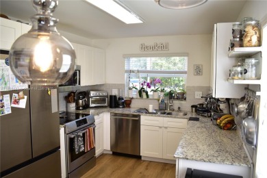 Large 1st Floor corner unit.  Privateplete impact glass on Sunrise Lakes Phase III in Florida - for sale on GolfHomes.com, golf home, golf lot