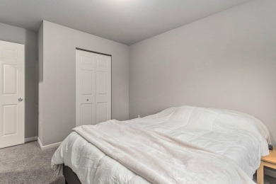 Welcome to this spacious 4-bedroom, 2.5-bath set on nearly half on Lake Doster Golf Club in Michigan - for sale on GolfHomes.com, golf home, golf lot