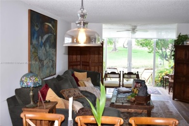 Large 1st Floor corner unit.  Privateplete impact glass on Sunrise Lakes Phase III in Florida - for sale on GolfHomes.com, golf home, golf lot