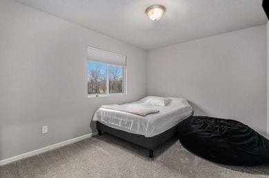 Welcome to this spacious 4-bedroom, 2.5-bath set on nearly half on Lake Doster Golf Club in Michigan - for sale on GolfHomes.com, golf home, golf lot