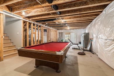 Welcome to this spacious 4-bedroom, 2.5-bath set on nearly half on Lake Doster Golf Club in Michigan - for sale on GolfHomes.com, golf home, golf lot