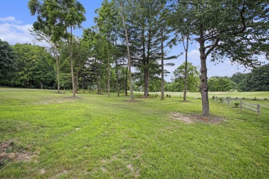 Welcome to this spacious 4-bedroom, 2.5-bath set on nearly half on Lake Doster Golf Club in Michigan - for sale on GolfHomes.com, golf home, golf lot