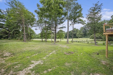 Welcome to this spacious 4-bedroom, 2.5-bath set on nearly half on Lake Doster Golf Club in Michigan - for sale on GolfHomes.com, golf home, golf lot