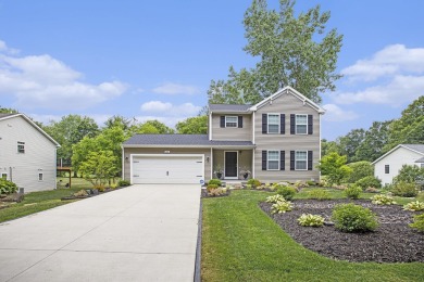 Welcome to this spacious 4-bedroom, 2.5-bath set on nearly half on Lake Doster Golf Club in Michigan - for sale on GolfHomes.com, golf home, golf lot