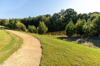Welcome to this beautifully maintained 4 bedroom, 2.5 bath home on Heritage Golf Club in North Carolina - for sale on GolfHomes.com, golf home, golf lot