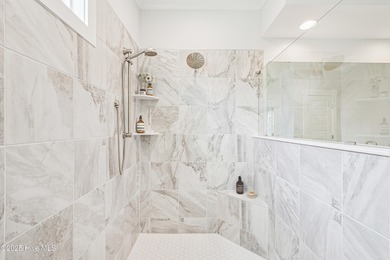 Discover the Skiff, a beautiful new Logan Home, located in on Sea Trail Golf Resort in North Carolina - for sale on GolfHomes.com, golf home, golf lot