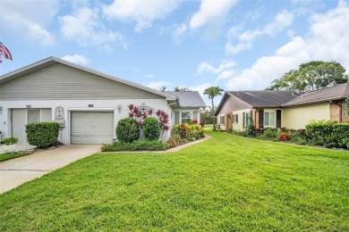 Welcome to this beautifully updated villa in Palm Harbor's on Highland Lakes Executive Golf Course in Florida - for sale on GolfHomes.com, golf home, golf lot