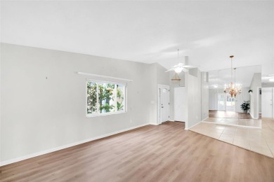 Welcome to this beautifully updated villa in Palm Harbor's on Highland Lakes Executive Golf Course in Florida - for sale on GolfHomes.com, golf home, golf lot