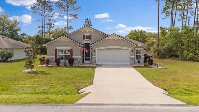 Welcome to 4 Eastmoor Ln, Palm Coast, FL 32164, an inviting and on The Grand Club Cypress Course in Florida - for sale on GolfHomes.com, golf home, golf lot