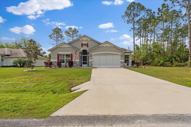 Welcome to 4 Eastmoor Ln, Palm Coast, FL 32164, an inviting and on The Grand Club Cypress Course in Florida - for sale on GolfHomes.com, golf home, golf lot