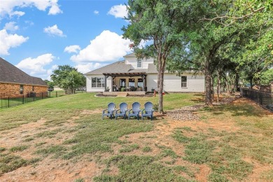 MAGNIFICENT WATERFRONT CUSTOM HOME SITUATED IN THE ESTEEMED on Sugar Tree Golf and Country Club in Texas - for sale on GolfHomes.com, golf home, golf lot