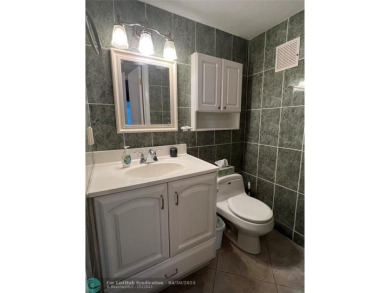 LOCATION! LOCATION!! DIRECTLY AROSS FROM THE CLUBHOUSE! COME AND on Hillsboro Pines Golf in Florida - for sale on GolfHomes.com, golf home, golf lot