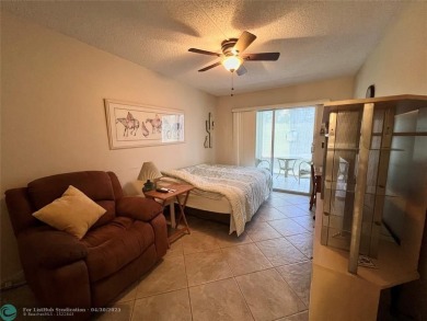 LOCATION! LOCATION!! DIRECTLY AROSS FROM THE CLUBHOUSE! COME AND on Hillsboro Pines Golf in Florida - for sale on GolfHomes.com, golf home, golf lot