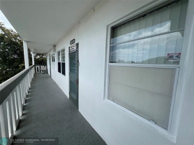 LOCATION! LOCATION!! DIRECTLY AROSS FROM THE CLUBHOUSE! COME AND on Hillsboro Pines Golf in Florida - for sale on GolfHomes.com, golf home, golf lot