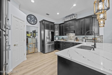 Discover your dream home in the exclusive Queens Harbour Yacht & on Queens Harbour Yacht and Country Club in Florida - for sale on GolfHomes.com, golf home, golf lot