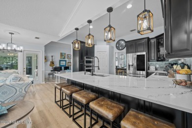 Discover your dream home in the exclusive Queens Harbour Yacht & on Queens Harbour Yacht and Country Club in Florida - for sale on GolfHomes.com, golf home, golf lot