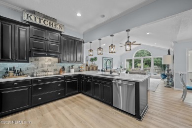 Discover your dream home in the exclusive Queens Harbour Yacht & on Queens Harbour Yacht and Country Club in Florida - for sale on GolfHomes.com, golf home, golf lot