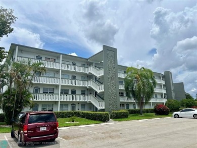 LOCATION! LOCATION!! DIRECTLY AROSS FROM THE CLUBHOUSE! COME AND on Hillsboro Pines Golf in Florida - for sale on GolfHomes.com, golf home, golf lot