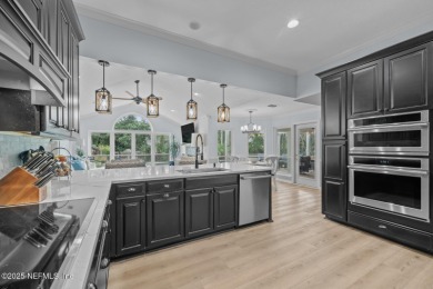 Discover your dream home in the exclusive Queens Harbour Yacht & on Queens Harbour Yacht and Country Club in Florida - for sale on GolfHomes.com, golf home, golf lot