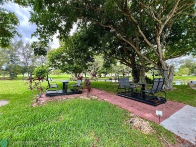 LOCATION! LOCATION!! DIRECTLY AROSS FROM THE CLUBHOUSE! COME AND on Hillsboro Pines Golf in Florida - for sale on GolfHomes.com, golf home, golf lot