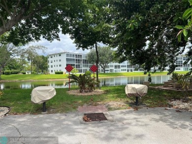 LOCATION! LOCATION!! DIRECTLY AROSS FROM THE CLUBHOUSE! COME AND on Hillsboro Pines Golf in Florida - for sale on GolfHomes.com, golf home, golf lot