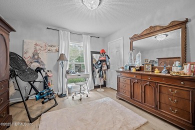 Discover your dream home in the exclusive Queens Harbour Yacht & on Queens Harbour Yacht and Country Club in Florida - for sale on GolfHomes.com, golf home, golf lot