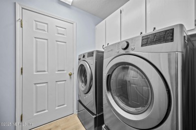 Discover your dream home in the exclusive Queens Harbour Yacht & on Queens Harbour Yacht and Country Club in Florida - for sale on GolfHomes.com, golf home, golf lot