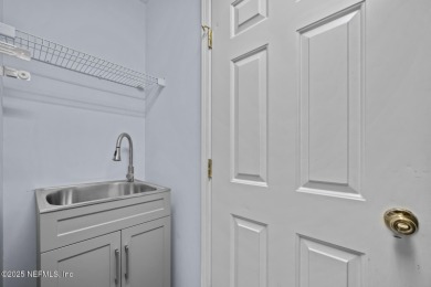 Discover your dream home in the exclusive Queens Harbour Yacht & on Queens Harbour Yacht and Country Club in Florida - for sale on GolfHomes.com, golf home, golf lot