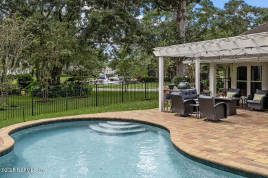 Discover your dream home in the exclusive Queens Harbour Yacht & on Queens Harbour Yacht and Country Club in Florida - for sale on GolfHomes.com, golf home, golf lot