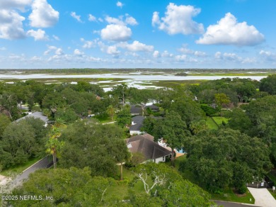 Discover your dream home in the exclusive Queens Harbour Yacht & on Queens Harbour Yacht and Country Club in Florida - for sale on GolfHomes.com, golf home, golf lot