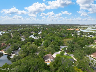 Discover your dream home in the exclusive Queens Harbour Yacht & on Queens Harbour Yacht and Country Club in Florida - for sale on GolfHomes.com, golf home, golf lot