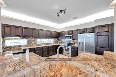 Welcome to this executive style 4 Bedroom, 3 Bath, 3 Car Garage on Crescent Oaks Country Club in Florida - for sale on GolfHomes.com, golf home, golf lot
